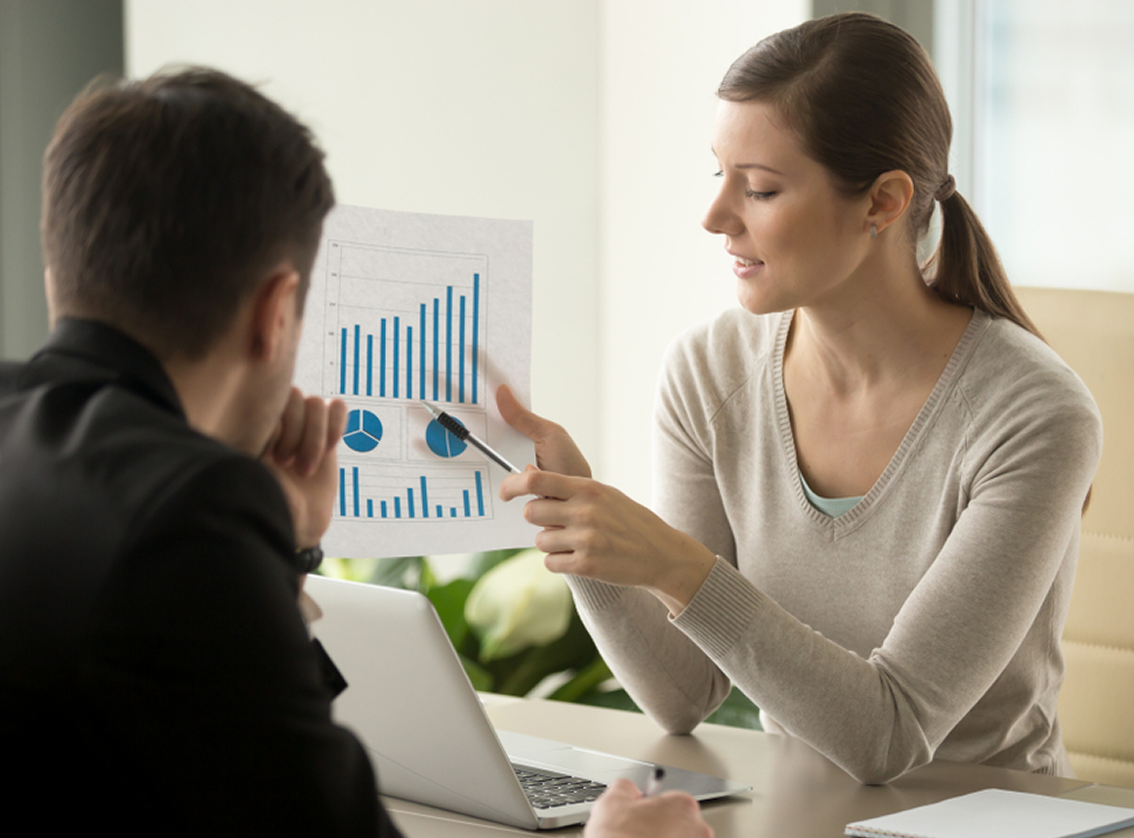 Business people looking at charts